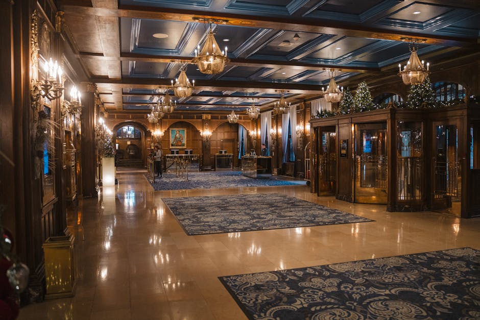 Elegant hotel lobby with chandeliers and blue accents in Québec City, Canada.