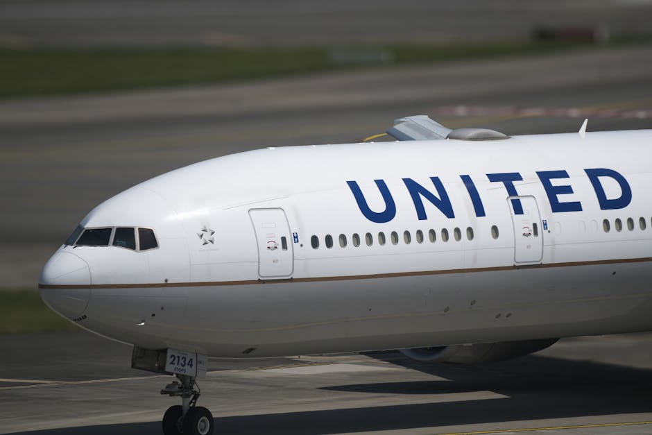 Close-up of a United Airlines airplane on taxiway, emphasizing the aircraft's details.