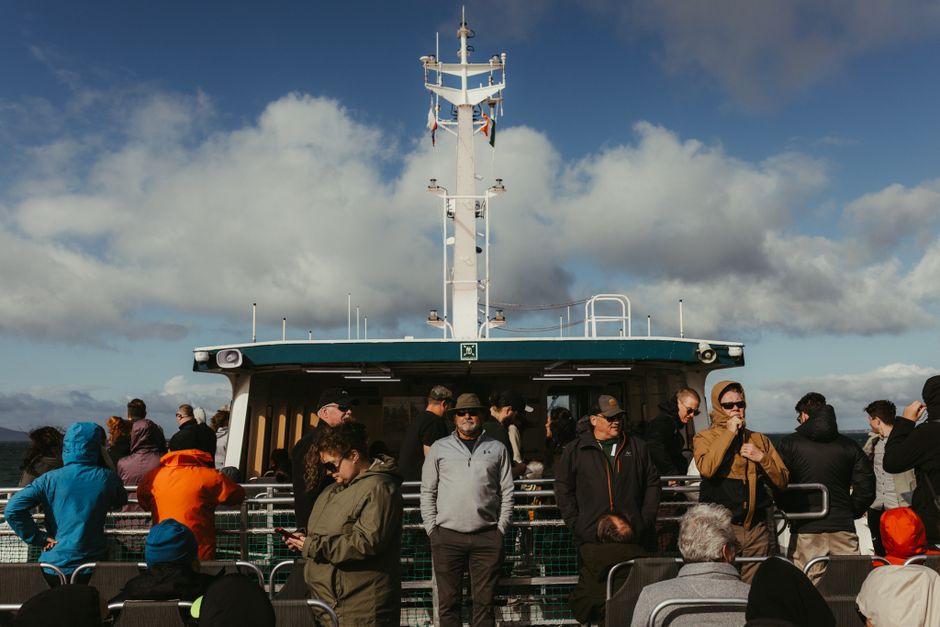 Holidaymakers on the deck of a ferry crossing in Ireland