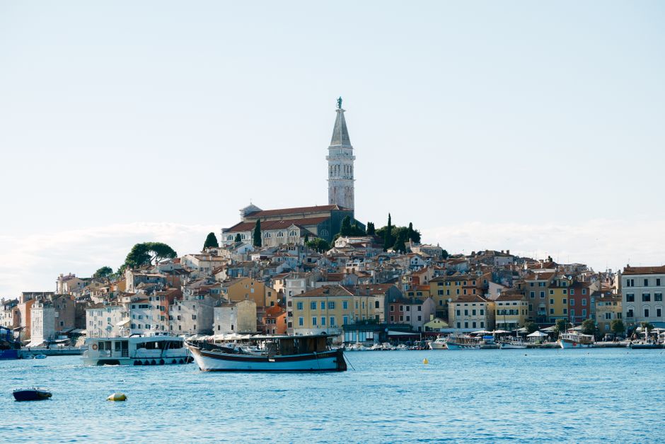 Scenic view of Rovinj with its iconic church and colorful coastal houses, Croatia.