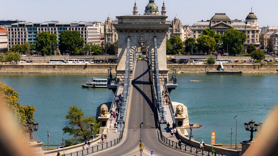 A vibrant summer day at Budapest's iconic Chain Bridge, showcasing its architectural beauty.