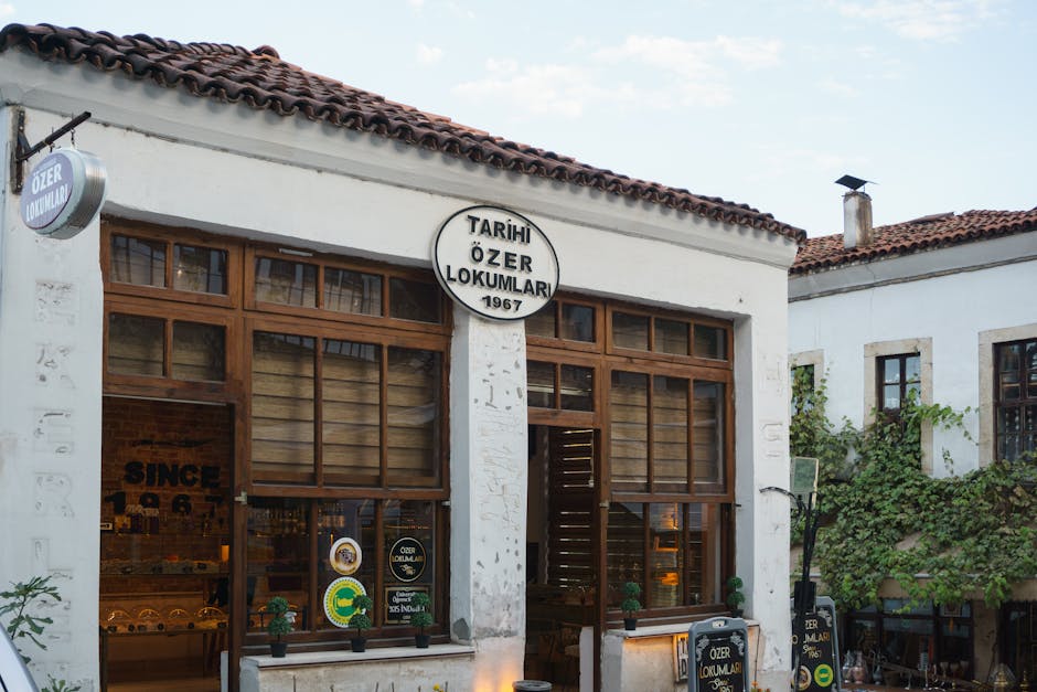Exterior of a traditional Turkish lokum shop with historic architecture, showcasing a charming outdoor setting.