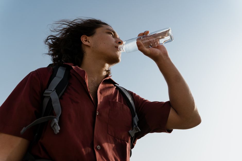 Traveller drinking water on a hot sunny day